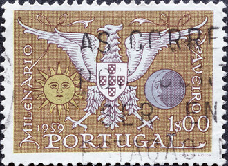 Portugal - circa 1959: a postage stamp from Portugal, showing an eagle the Coat of Arms of Aveiro....