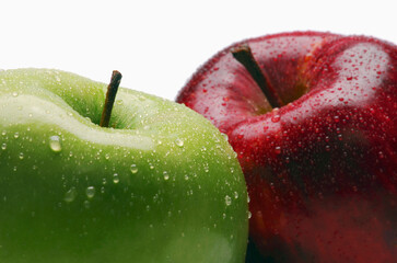 Two fresh apples with drops of water isolated on white background.