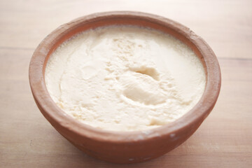 fresh yogurt in a bowl on table 