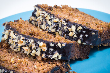 Pastry made of zucchini with nuts and raisin. Delicious dessert. White background