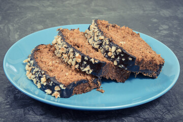 Homemade pastry made of zucchini with nuts and raisin on backgrond of concrete