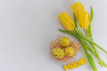 Fototapeta na wymiar Yellow easter eggs and decorative easter and spring objects