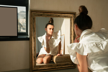 Girl in a white dress in a beige interior with a modern hairstyle

Young beautiful Ukrainian woman sitting on the floor on a round rug looks to the mirror hair gathered in a stylish hairstyle 