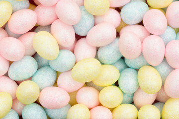 Fototapeta na wymiar Colorful pastel Easter eggs candy background