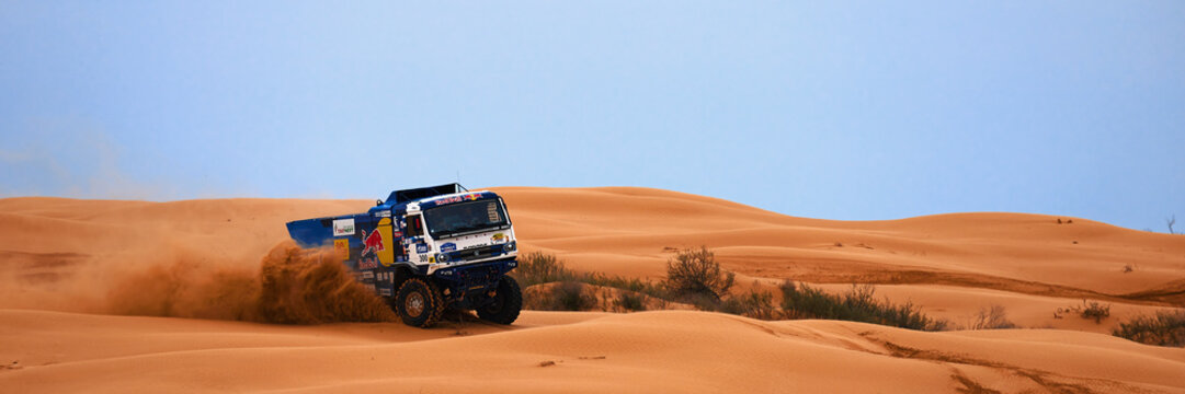 Sports truck KAMAZ gets over the difficult part of the route during the Rally raid in sand. THE GOLD OF KAGAN-2021. 26.04.2021 Astrakhan, Russia