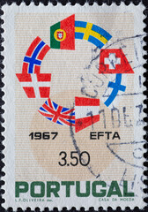 Portugal - circa 1967 : a postage stamp from Portugal , showing a Ring of Flags of the E.F.T.A....