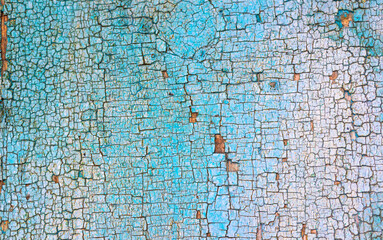 Old wood texture with colorful cracked paint. Retro and vintage high detailed background, close-up view photo