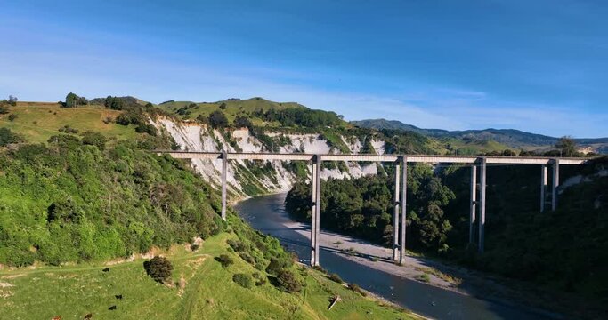 Flying towards South Rangitikei Viaduct over farm and cattle -  New Zealand
