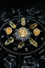 quartz minerals and crystal balls on black divination zodiac astrology napkin. esoteric practices with natural gemstones. Magic Crystal Ritual for uplifting positive spirit, prosperity, harmony.