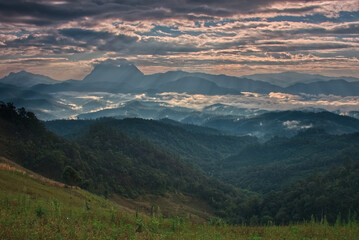 Fototapeta premium Light beam over a mountain valley with twilight sky in a morning