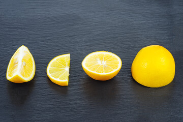 Pieces of lemon on a black background
