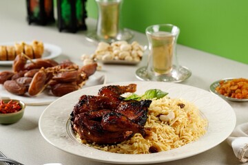 Kabsa, Arabian Dish made of Long Grain Basmati Rice, Roasted Whole Chicken, Onion, Spices (Cardamom, Saffron, Cinnamon, Bay leaves)