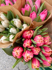 bouquets of colored tulips in a street shop