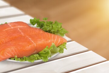 Fresh fish fillet. On a wooden background.