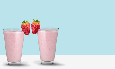 Protein rich smoothies with yogurt and frozen strawberries in glass. Bright berry