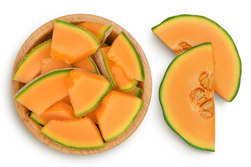 Cantaloupe melon pieces in wooden bowl isolated on white background with clipping path and full depth of field. Top view. Flat lay