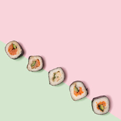 Flat lay sushi vegetarian concept. Many sushi with salmon, squid, tuna fish, rice, cucumber carrots...