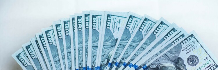 Fototapeta premium Fan of hundred dollars banknotes