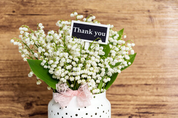 Beautiful lily of the valley  flowers and thank you message .Thank you card with spring flowers 