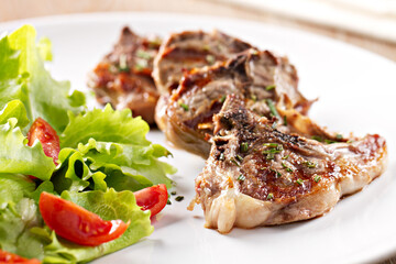 Grilled lamb chops with mixed salad. High quality photo