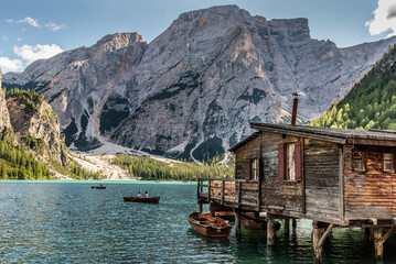 September 2021, Fanes-Sennes-Braies Natural Park, panorama of the Dolomite lake with stilt houses and rowing boats