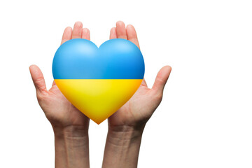 The concept of ending the war in Ukraine. Heart in the colors of the flag of Ukraine in female hands isolated on white background with clipping path
