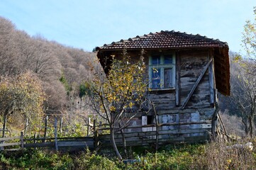 an old wooden abandoned house in the village