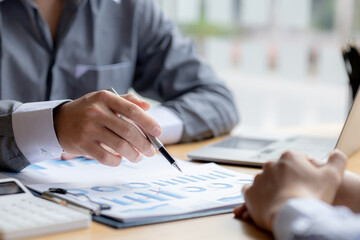 Atmosphere brainstorming session of a startup company, two founders of the company attended a meeting to plan the management and financial growth of the company. Management startup company concept.