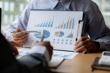 Atmosphere brainstorming session of a startup company, two founders of the company attended a meeting to plan the management and financial growth of the company. Management startup company concept.