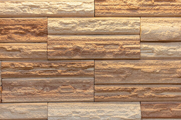 brown stone walls, paving lines, alternating stone materials, wall coverings in interior or exterior applications.