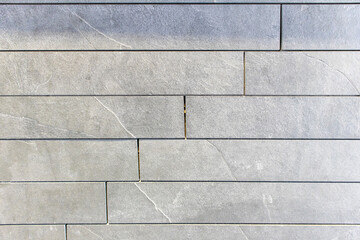 The stone wall is cut from small slabs to form a horizontal,Interior decoration materials,gray stone wall