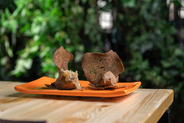 Rye bread croutons as a garnish for pate. High quality restaurant food.