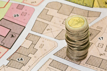 Land registry fees in European Union - concept with an imaginary cadastral map of territory with...