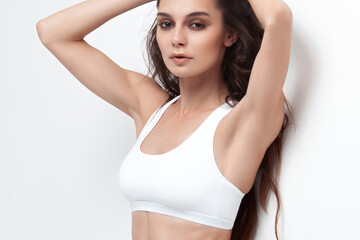 Beautiful girl in white lingerie on white background.