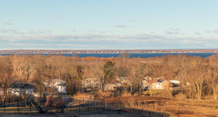 Distance view of a small residential neighborhood near Newport, Rhode Island, on a snowy winter...