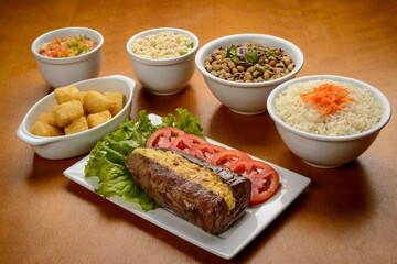 Sun meat and side dishes. Carne de sol, salted steak, typical dish from the Brazilian northeast.