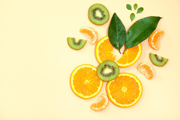 kiwi and orange on the neutral background