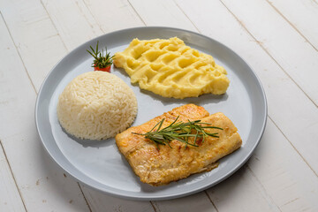 Fish. Tilapia fillet with white rice and mashed potatoes. Set meal.