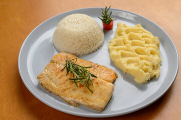 Fish. Tilapia fillet with white rice and mashed potatoes. Set meal.