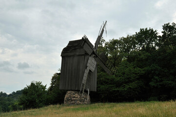 Fototapeta na wymiar old wooden mill in the Ukrainian village