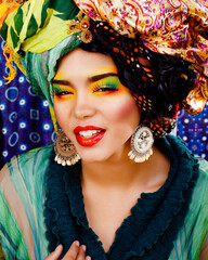 beauty bright african woman with creative make up, shawl on head like cuban woman