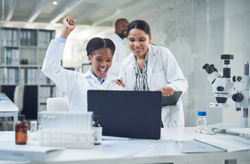 Well make history with this. Shot of a group of scientists cheering while working in a lab.