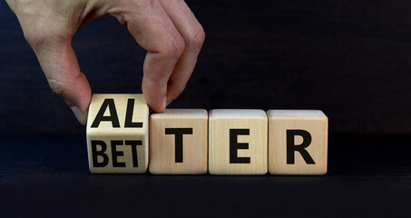 Alter or better symbol. Businessman turns wooden cubes and changes the word Alter to Better....