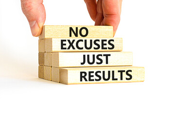 No excuses just results symbol. Concept words No excuses just results on wooden blocks. Businessman hand. Beautiful white table white background. No excuses just results business concept. Copy space.