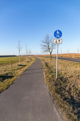 Empty road with a bike path inlaid next to it