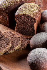 Homemade Australian bread with dark wholemeal flour on wooden board