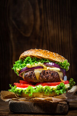 Restaurant Burger with Salad and Sauce on Wooden Background