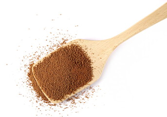 Coconut palm sugar pile in wooden spoon isolated on white, top view