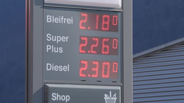 Handheld digital sign on a petrol station, shows high price due to economic crisis