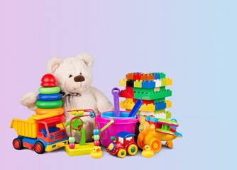Cute kid toys. Container with bear, blocks on light background. Cute toys collection for small children. Donation.